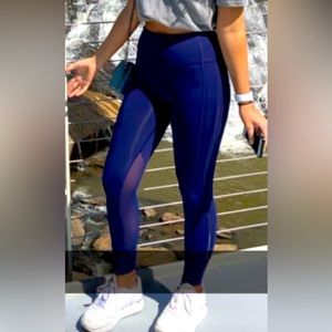 Size 2 navy blue lululemon leggings. Gently worn. Mesh detail in calf